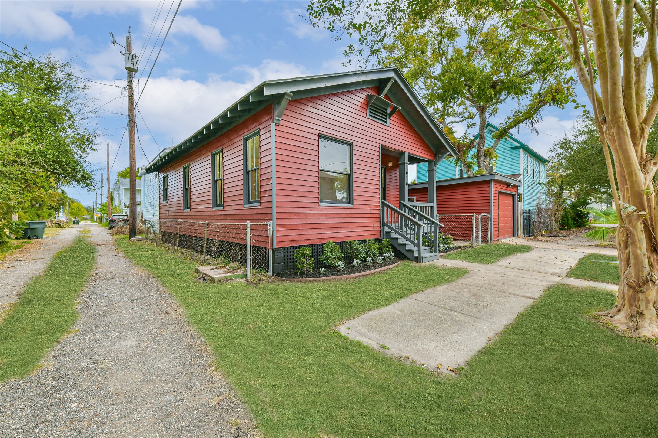 1616 38th Street Galveston, TX 77550 - Photo 2 of 26 a front view of a house with a yard