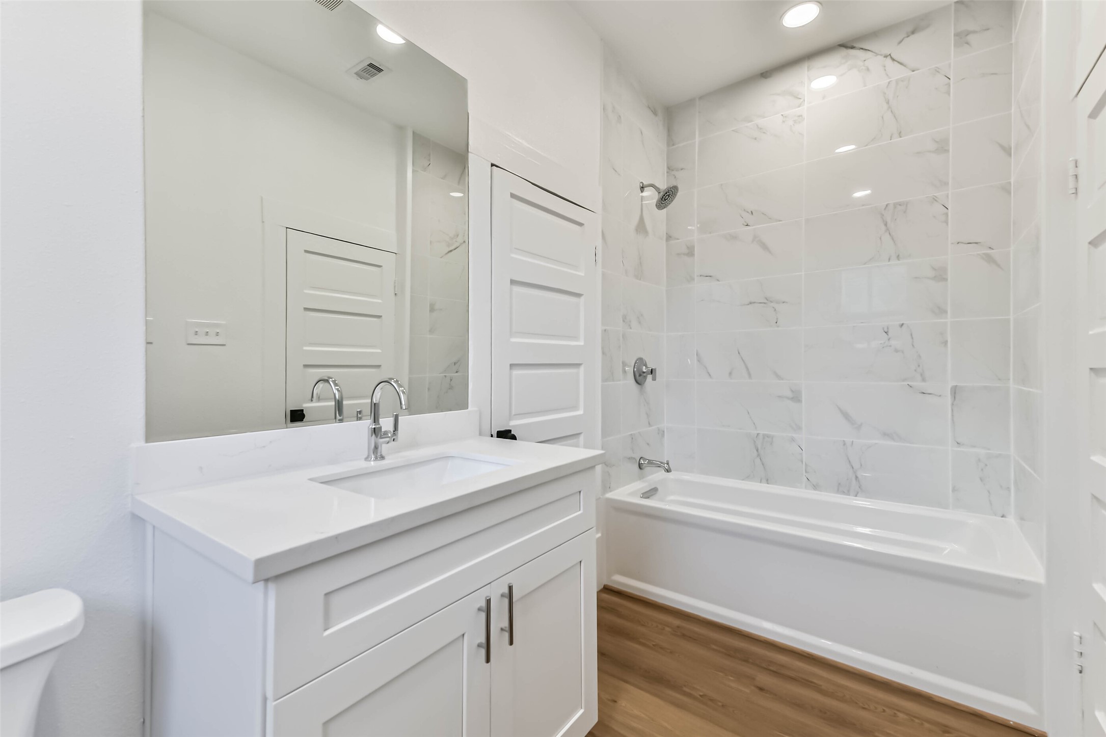 1616 38th Street Galveston, TX 77550 - Photo 21 of 26 a bathroom with a sink and a mirror