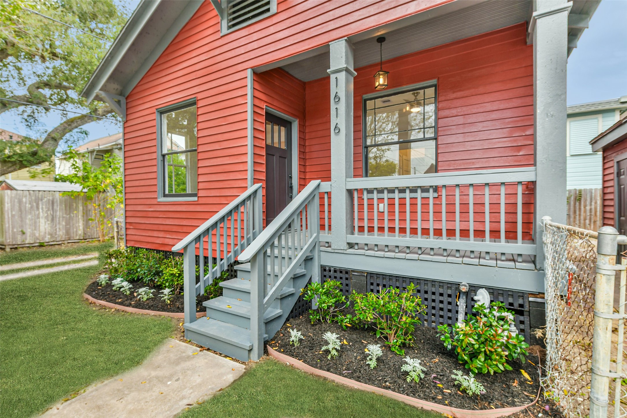 1616 38th Street Galveston, TX 77550 - Photo 4 of 26 a view of a house with a small yard and wooden floor