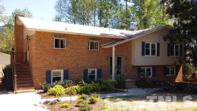 3208 Caldwell Drive Raleigh, NC 27607 - Photo 1 of 22 a front view of a house with a yard