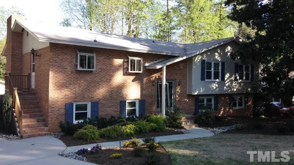3208 Caldwell Drive Raleigh, NC 27607 - Photo 22 of 22 a front view of a house with yard and tree s