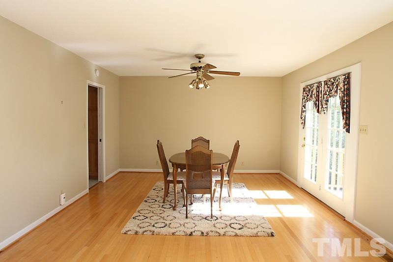 3208 Caldwell Drive Raleigh, NC 27607 - Photo 6 of 22 a view of a dining room with furniture and a chandelier