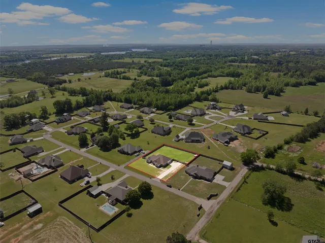 an aerial view of a house with a outdoor space