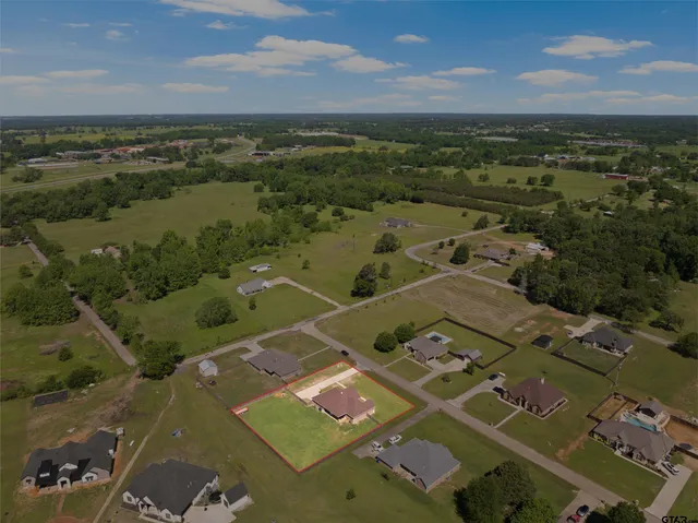 an aerial view of a building with outdoor view