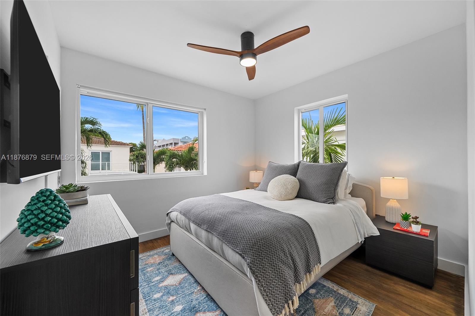 642 86th Street Miami Beach, FL 33141 - Photo 11 of 48 a bedroom with a bed dresser and a window