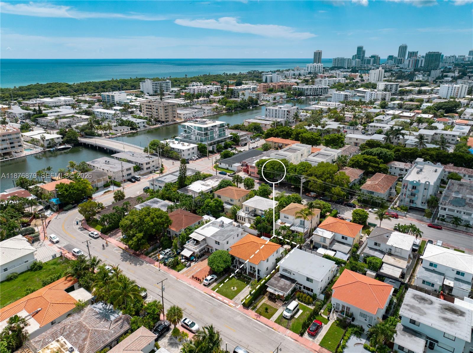 642 86th Street Miami Beach, FL 33141 - Photo 18 of 48 an aerial view of a city with lots of residential buildings ocean and mountain view in back