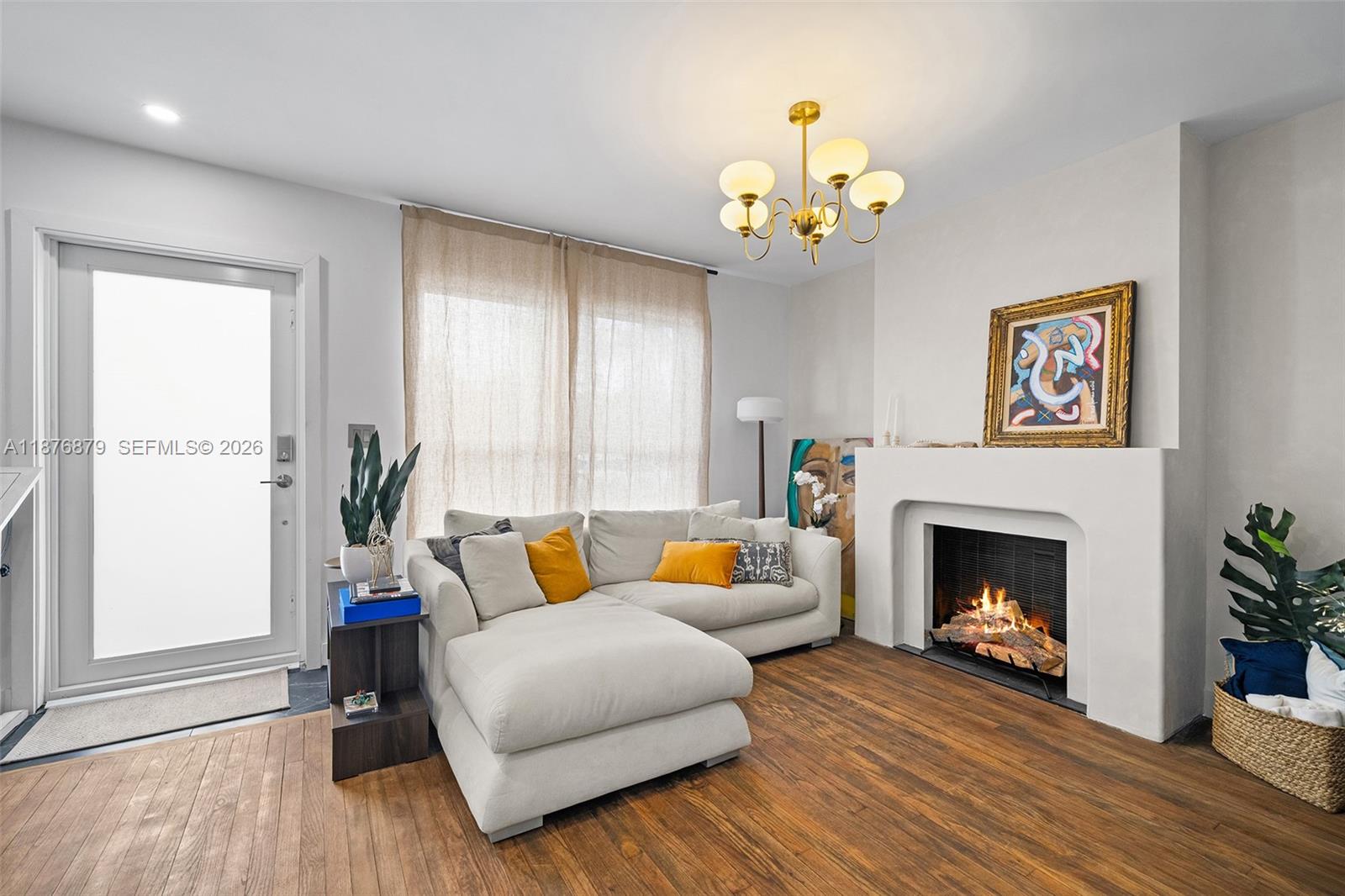 642 86th Street Miami Beach, FL 33141 - Photo 20 of 48 a living room with furniture and a fireplace