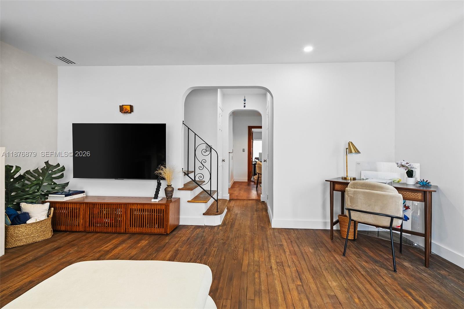 642 86th Street Miami Beach, FL 33141 - Photo 23 of 48 a living room with furniture and a flat screen tv