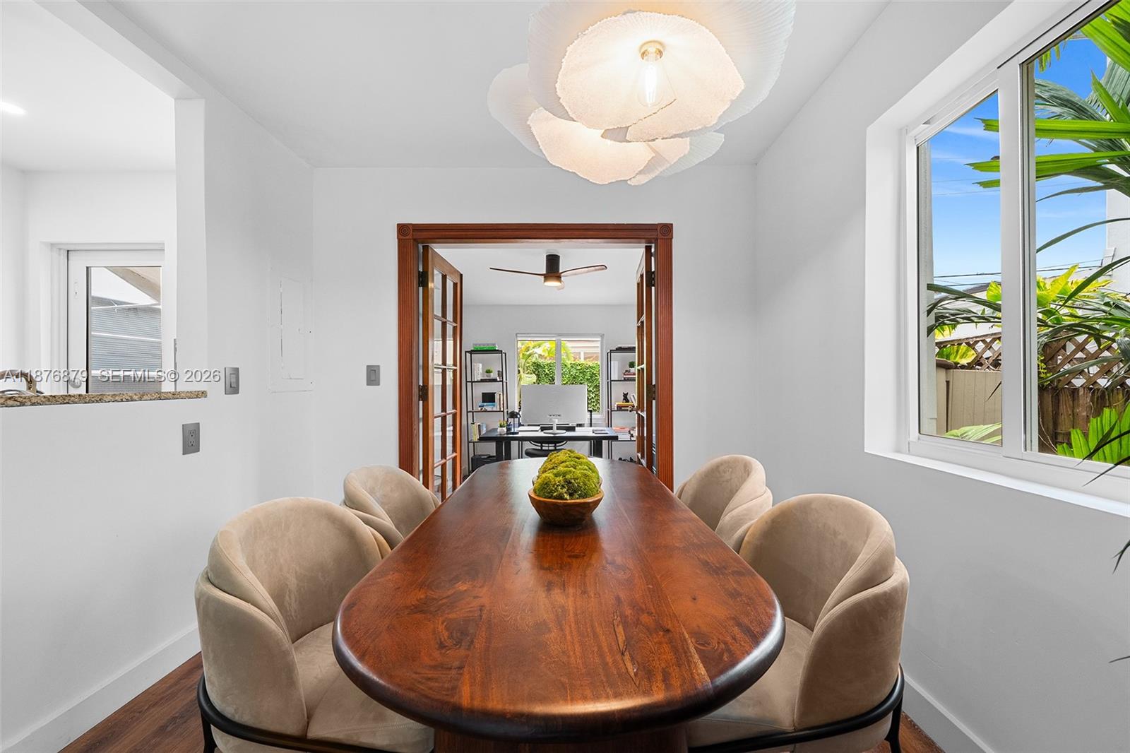 642 86th Street Miami Beach, FL 33141 - Photo 24 of 48 a view of a dining room with furniture and a window