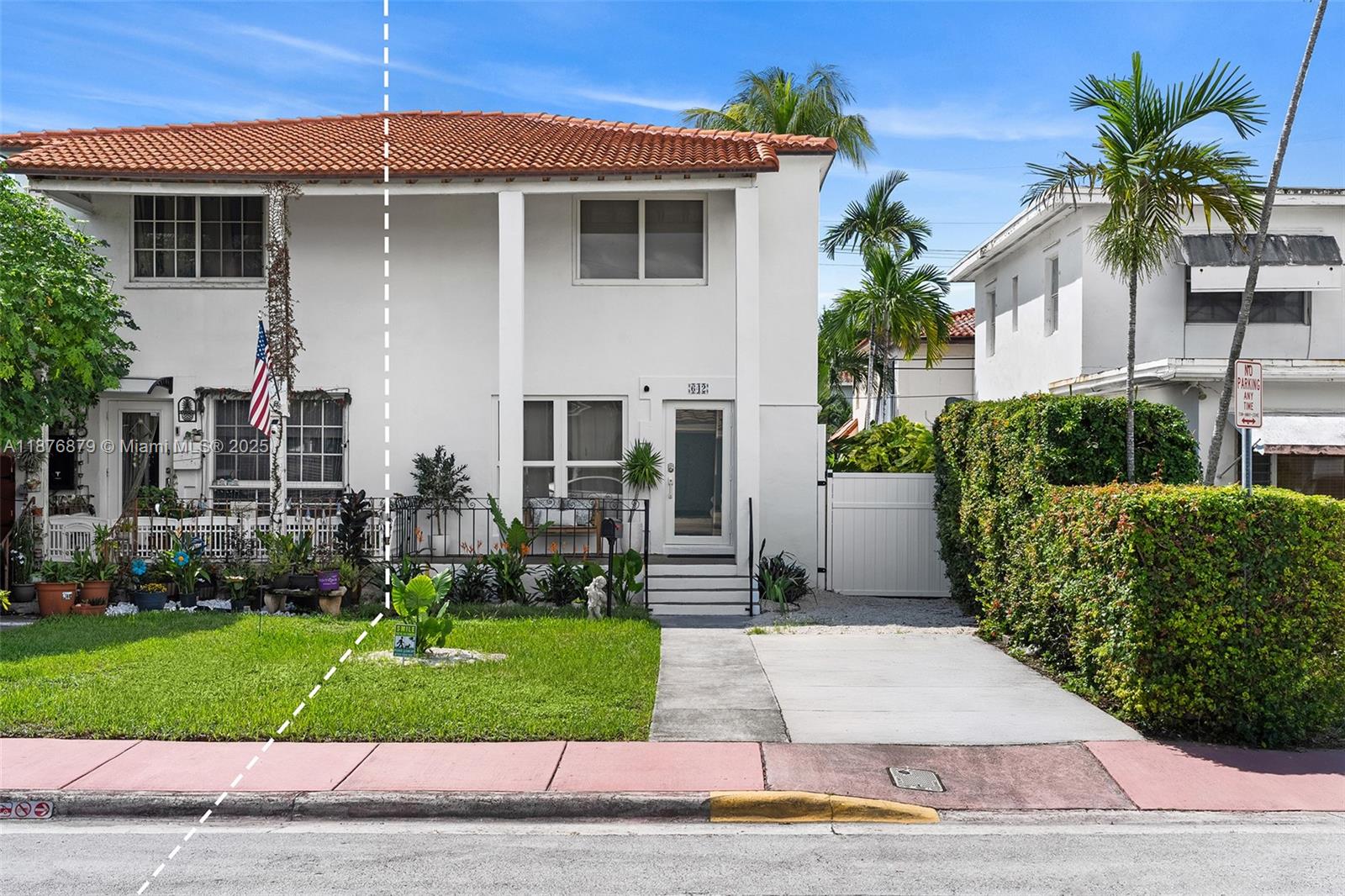 642 86th Street Miami Beach, FL 33141 - Photo 37 of 48 a front view of a house with a yard and potted plants