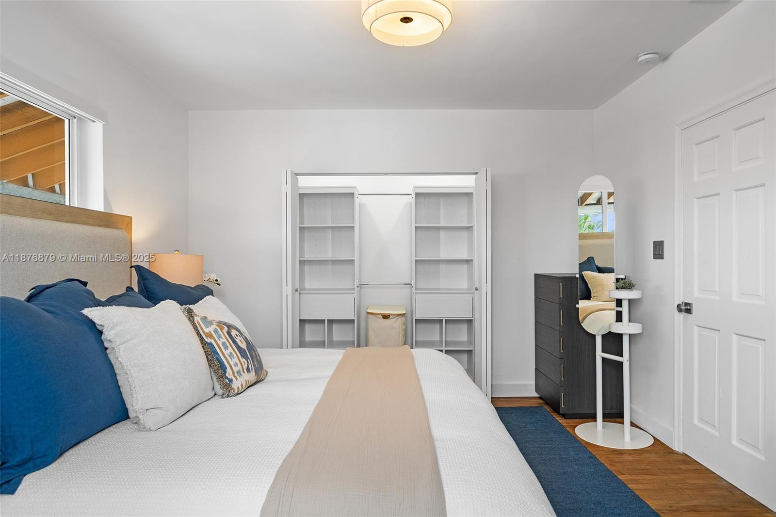 642 86th Street Miami Beach, FL 33141 - Photo 10 of 48 a bedroom with a bed and a cabinets