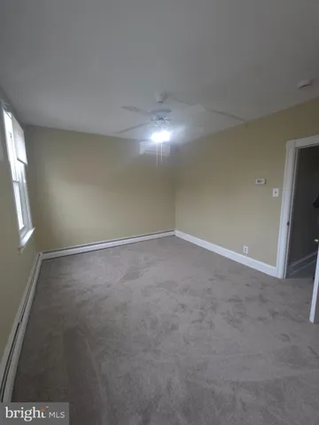 an empty room with a empty space and window