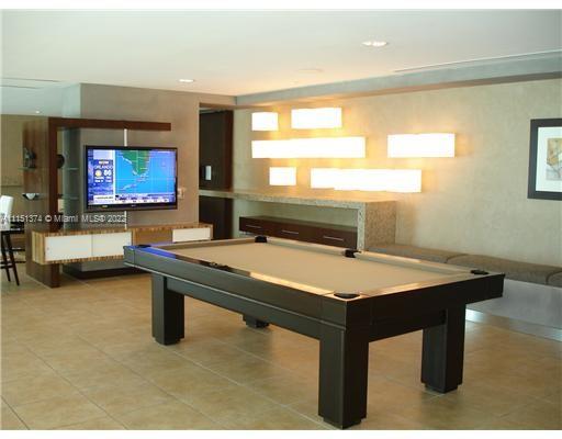 60 Southwest 13th Street, Unit 3003 Miami, FL 33130 - Photo 21 of 22 a room with furniture pool table and windows