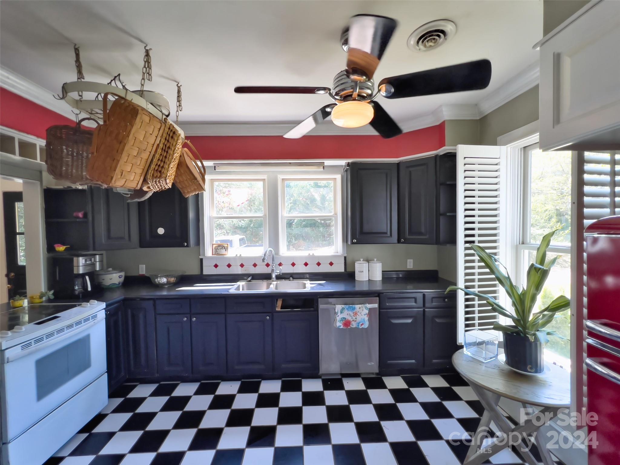 496 Chimney Rock Road Rutherfordton, NC 28139 - Photo 12 of 37 a kitchen with a sink a stove and cabinets