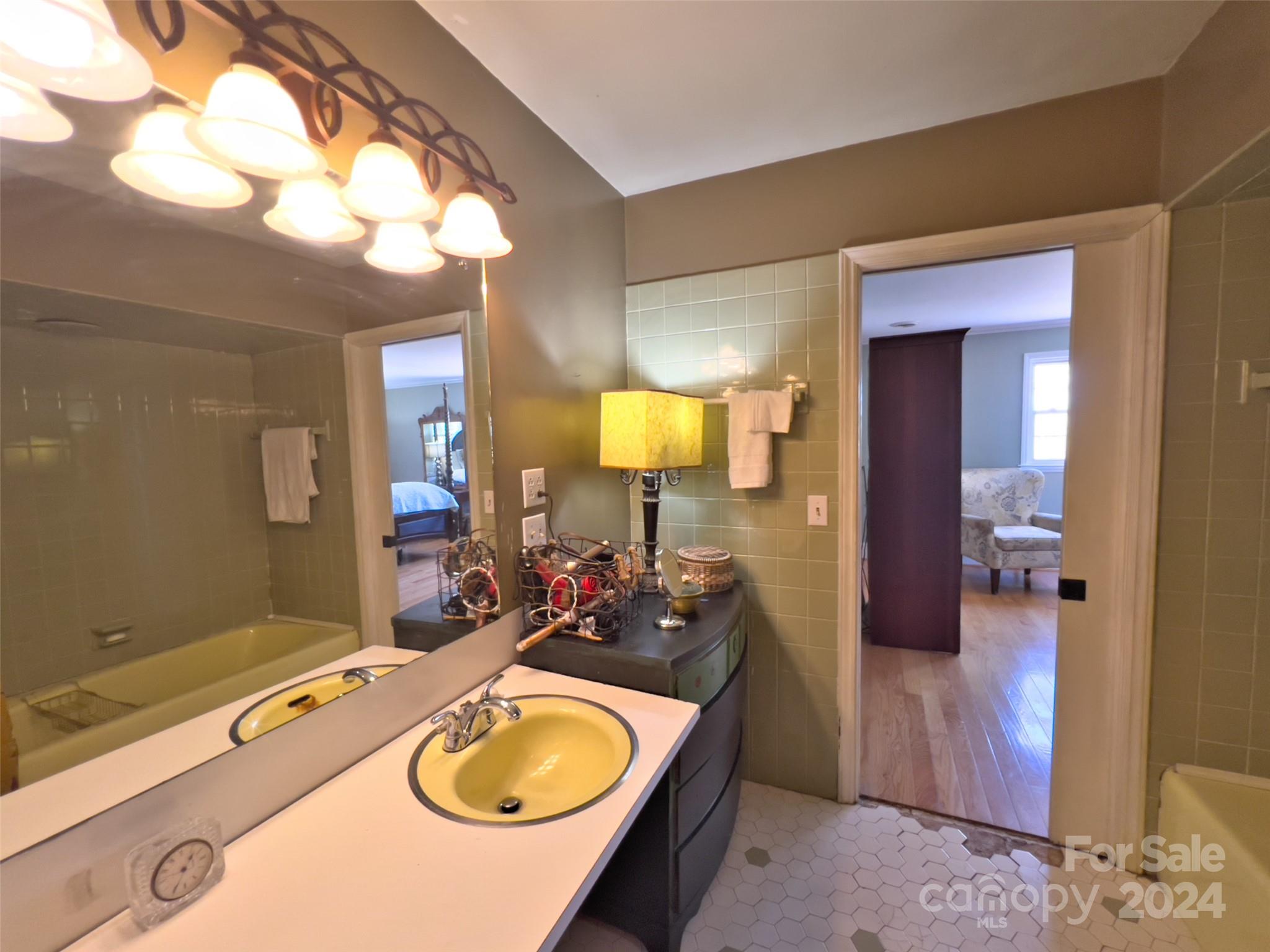 496 Chimney Rock Road Rutherfordton, NC 28139 - Photo 25 of 37 a bathroom with a sink and a mirror