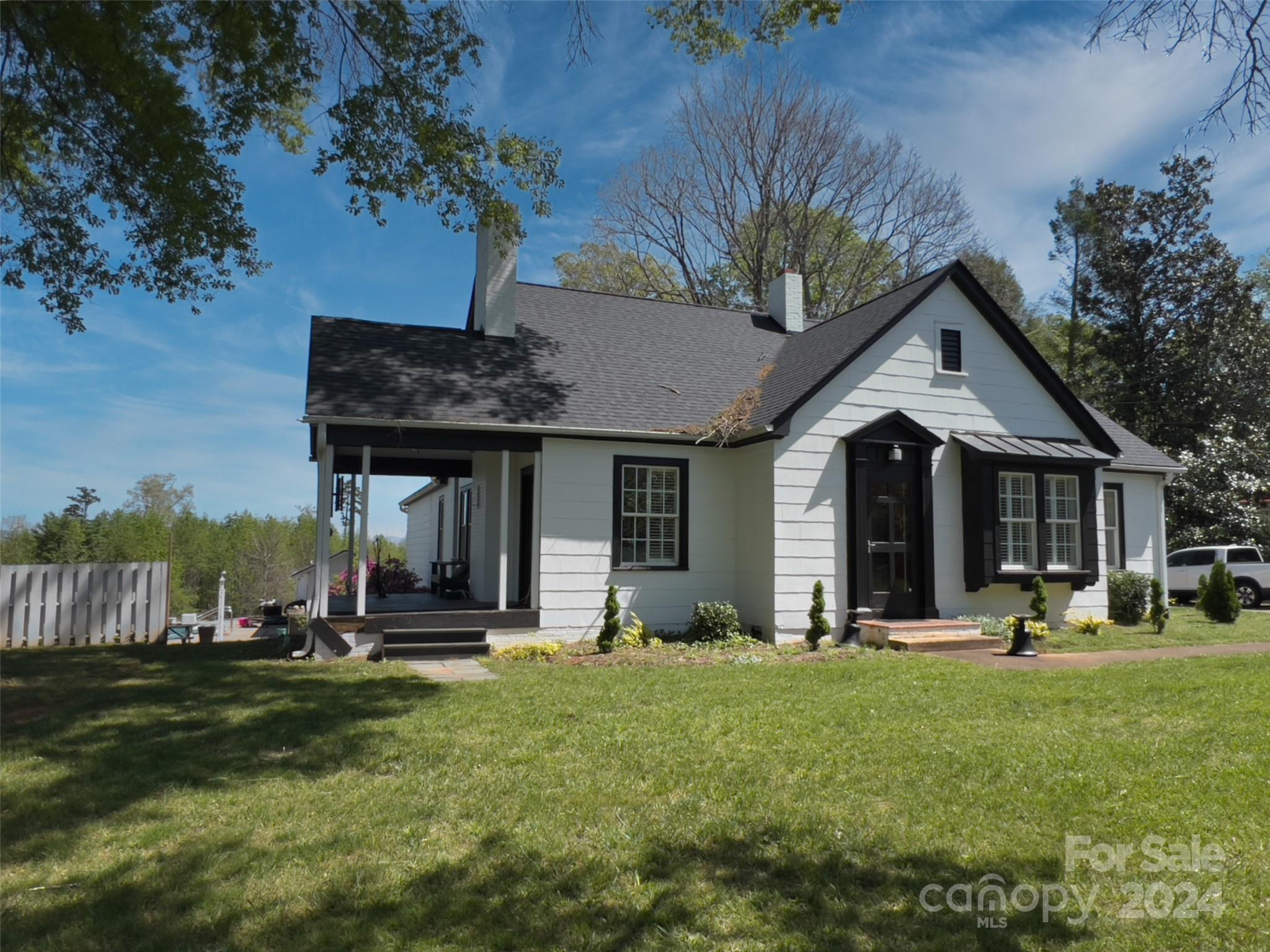 496 Chimney Rock Road Rutherfordton, NC 28139 - Photo 4 of 37 a front view of a house with a yard
