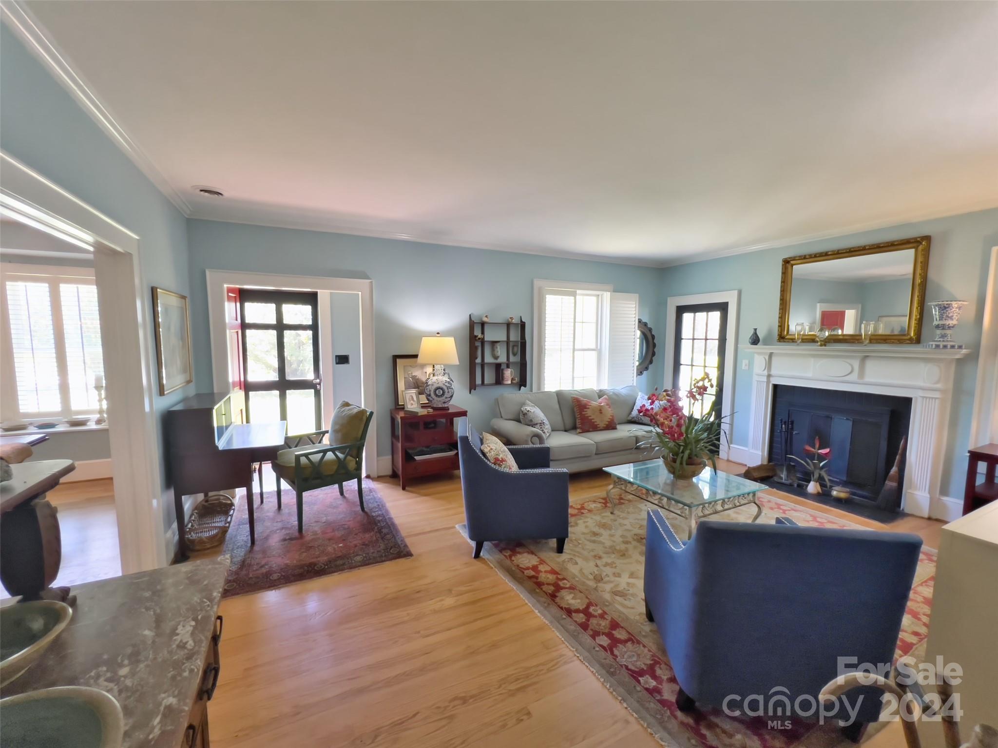 496 Chimney Rock Road Rutherfordton, NC 28139 - Photo 7 of 37 a living room with furniture large window and a fireplace