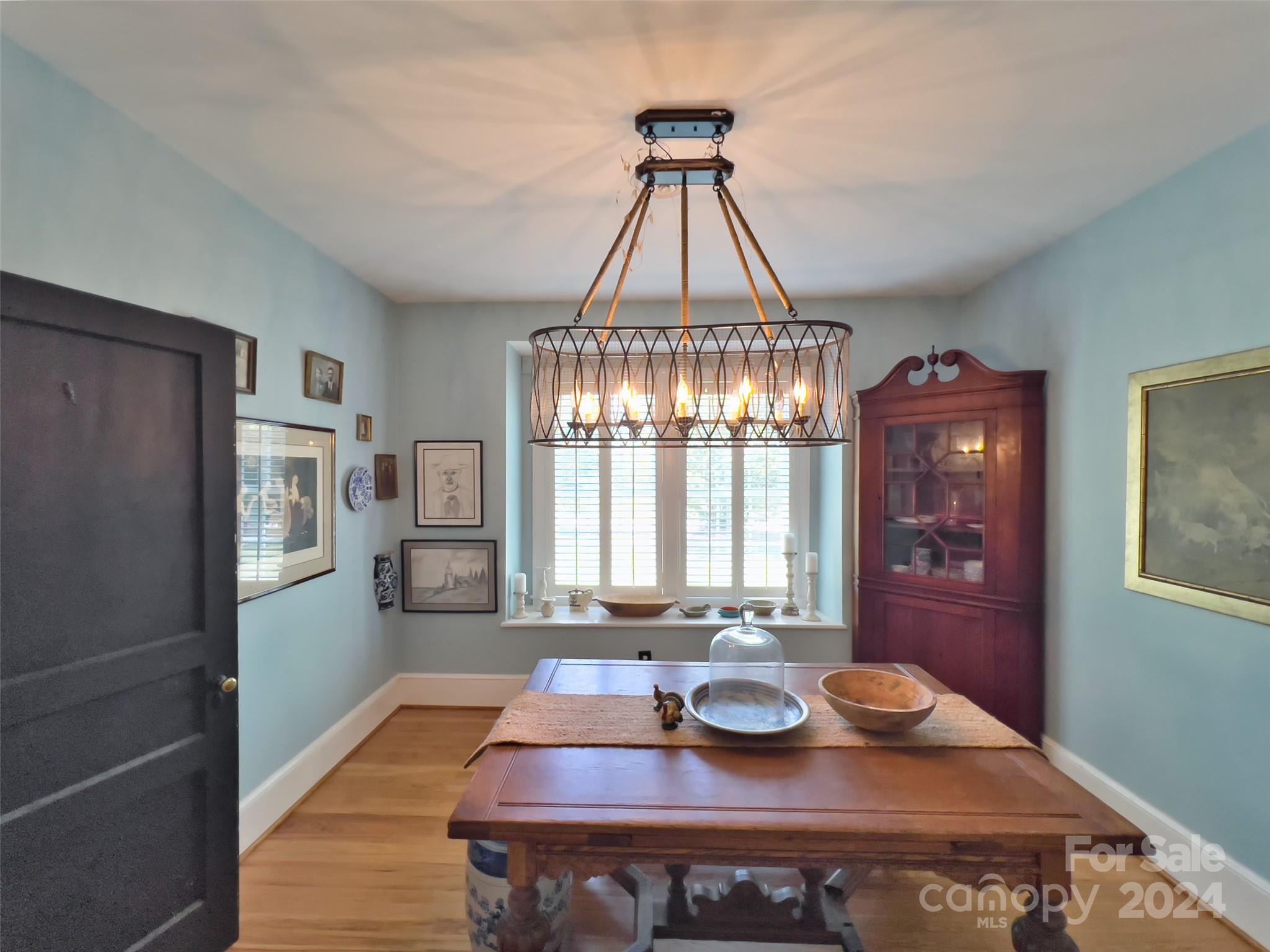 496 Chimney Rock Road Rutherfordton, NC 28139 - Photo 8 of 37 a view of a dining room with furniture a chandelier and wooden floor