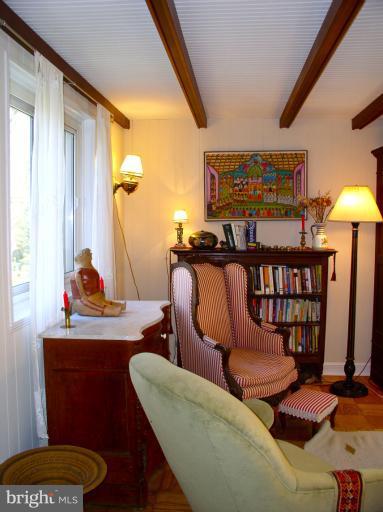 9 Ridge Road, Unit A Greenbelt, MD 20770 - Photo 1 of 30 Exposed ceiling beams in living and dining rooms.