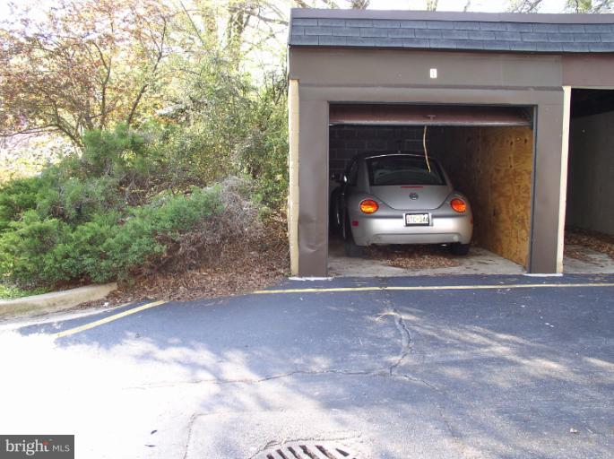 9 Ridge Road, Unit A Greenbelt, MD 20770 - Photo 15 of 30 Garage close-by at the edge of the property.