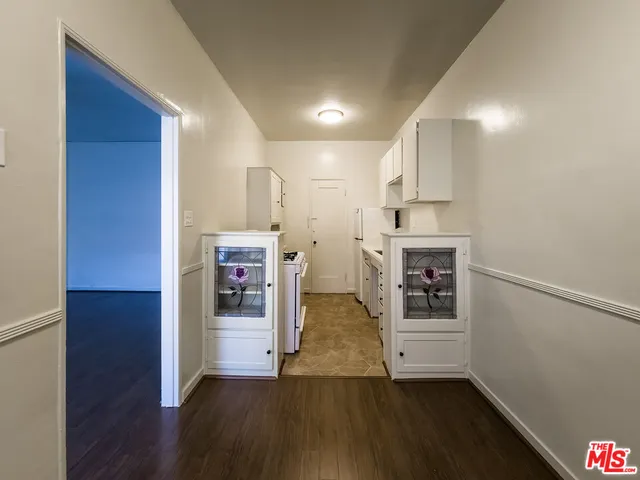 a view of a kitchen cabinets and wooden floor