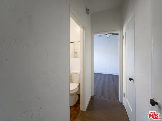 a view of a bathroom with sink and shower