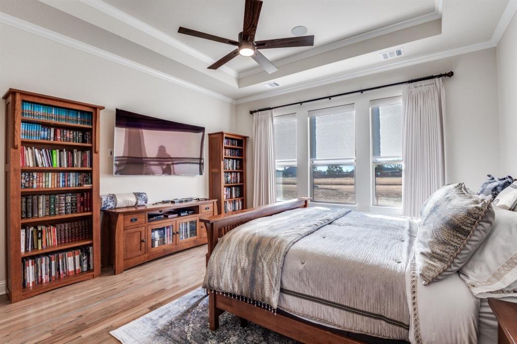 8210 Palmer Road Waxahachie, TX 75167 - Photo 24 of 39 a bedroom with a bed furniture and a book shelf
