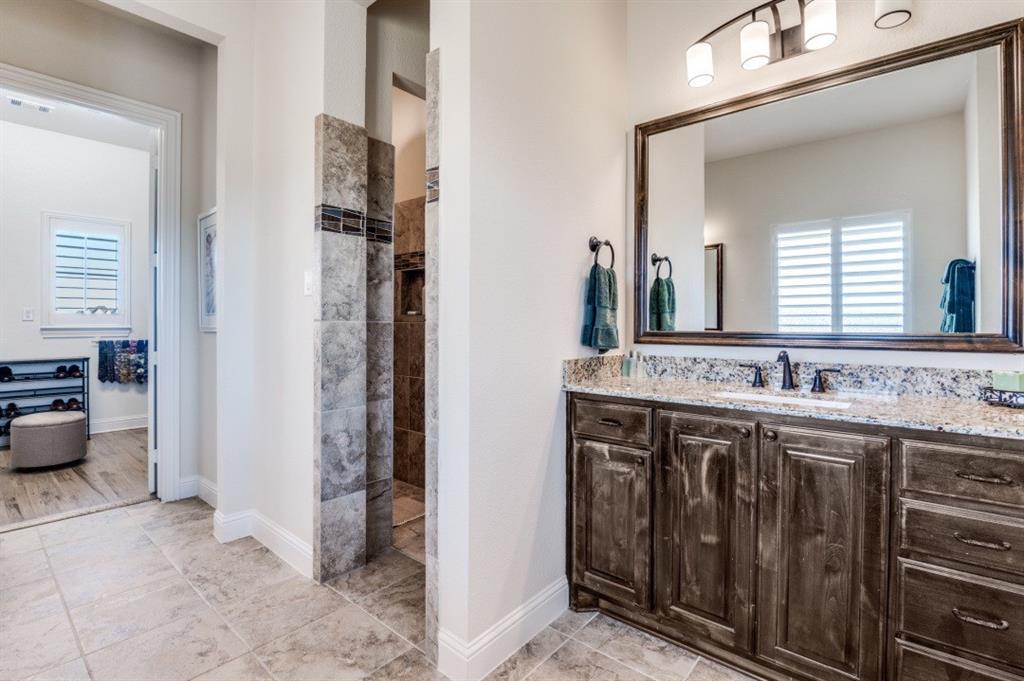 8210 Palmer Road Waxahachie, TX 75167 - Photo 26 of 39 a bathroom with a sink and a mirror
