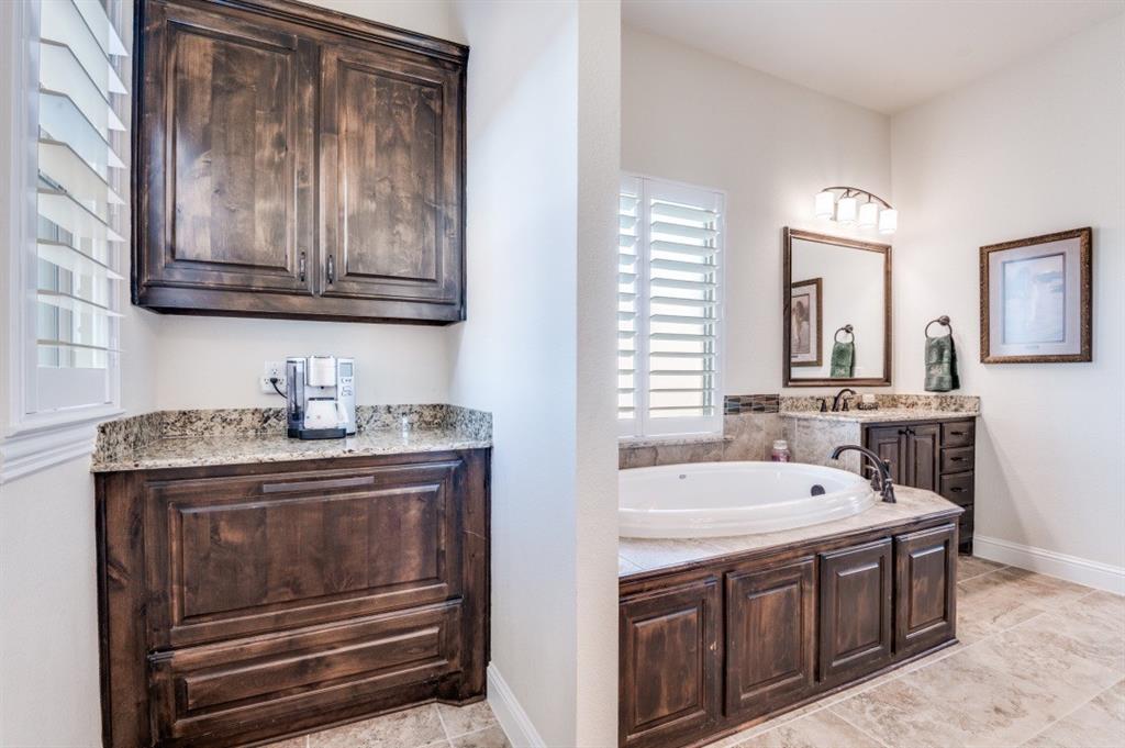 8210 Palmer Road Waxahachie, TX 75167 - Photo 28 of 39 a bathroom with a sink a stove and mirror