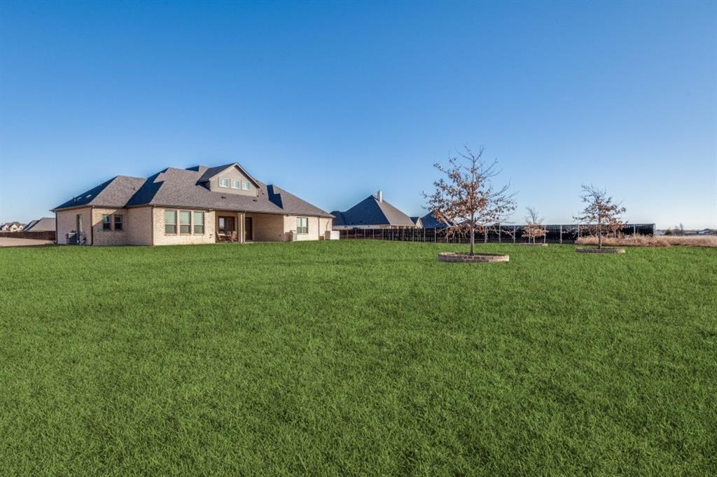 8210 Palmer Road Waxahachie, TX 75167 - Photo 34 of 39 a view of a house with a big yard and large trees