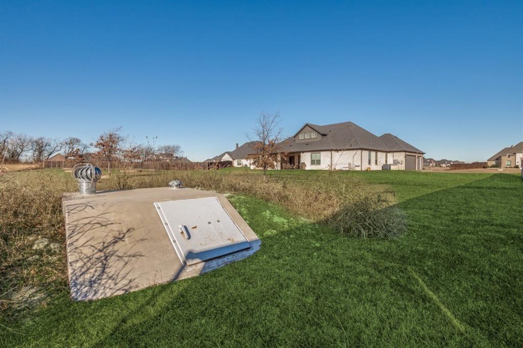 8210 Palmer Road Waxahachie, TX 75167 - Photo 36 of 39 a view of a big house with a big yard and large tree