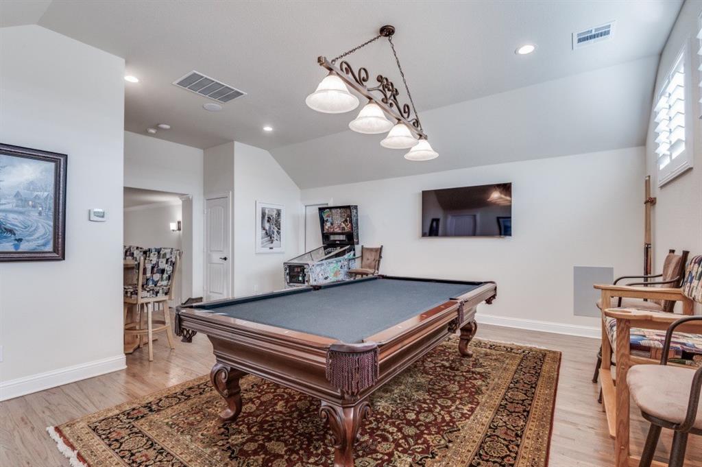 8210 Palmer Road Waxahachie, TX 75167 - Photo 8 of 39 a living room with pool table and a flat screen tv