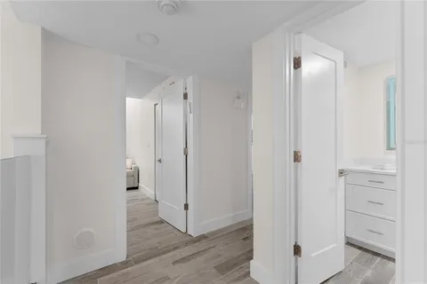 a living room with lots of furniture and a floor to ceiling window