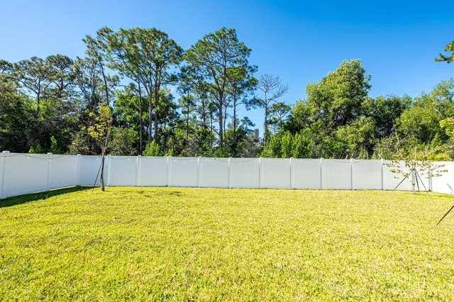 a view of a back yard from a room