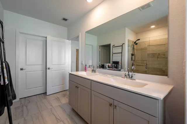an aerial view of a house with garden space and street view
