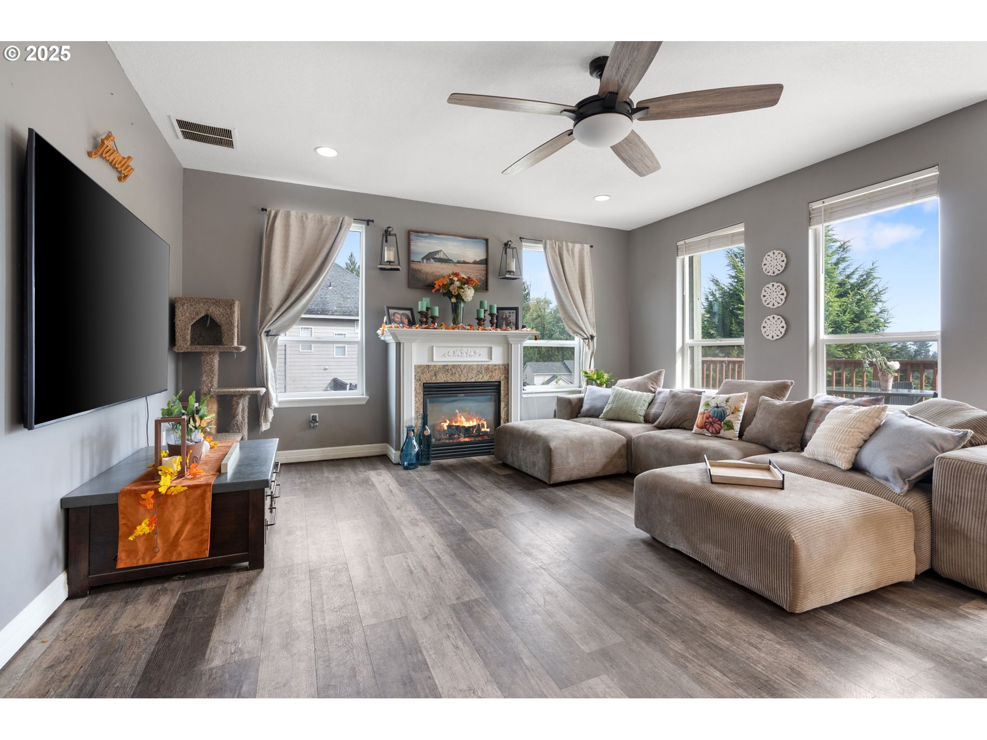 117 Altavista Road Longview, WA 98632 - Photo 17 of 40 a living room with furniture fireplace and a large window