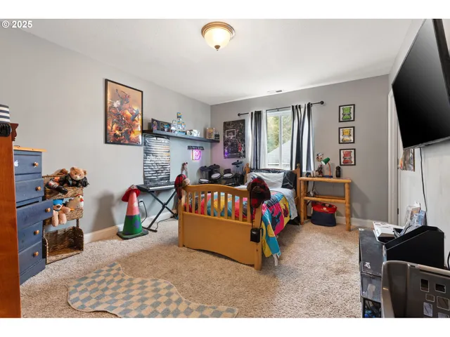 a bathroom with a granite countertop sink a toilet a mirror and shower curtain
