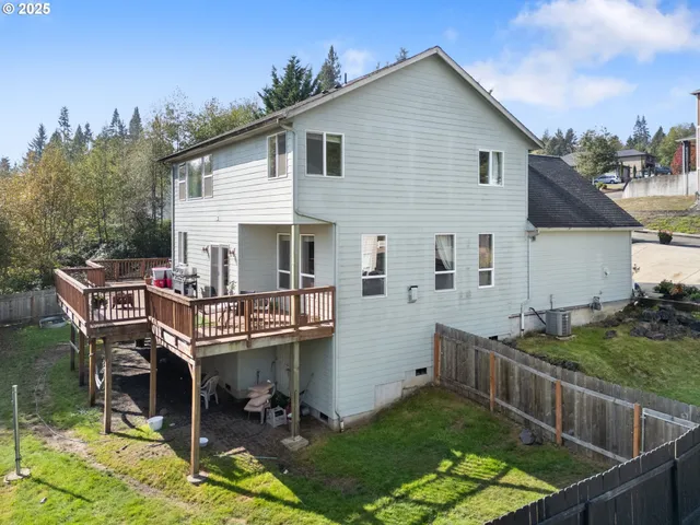 an aerial view of a house with an outdoor space