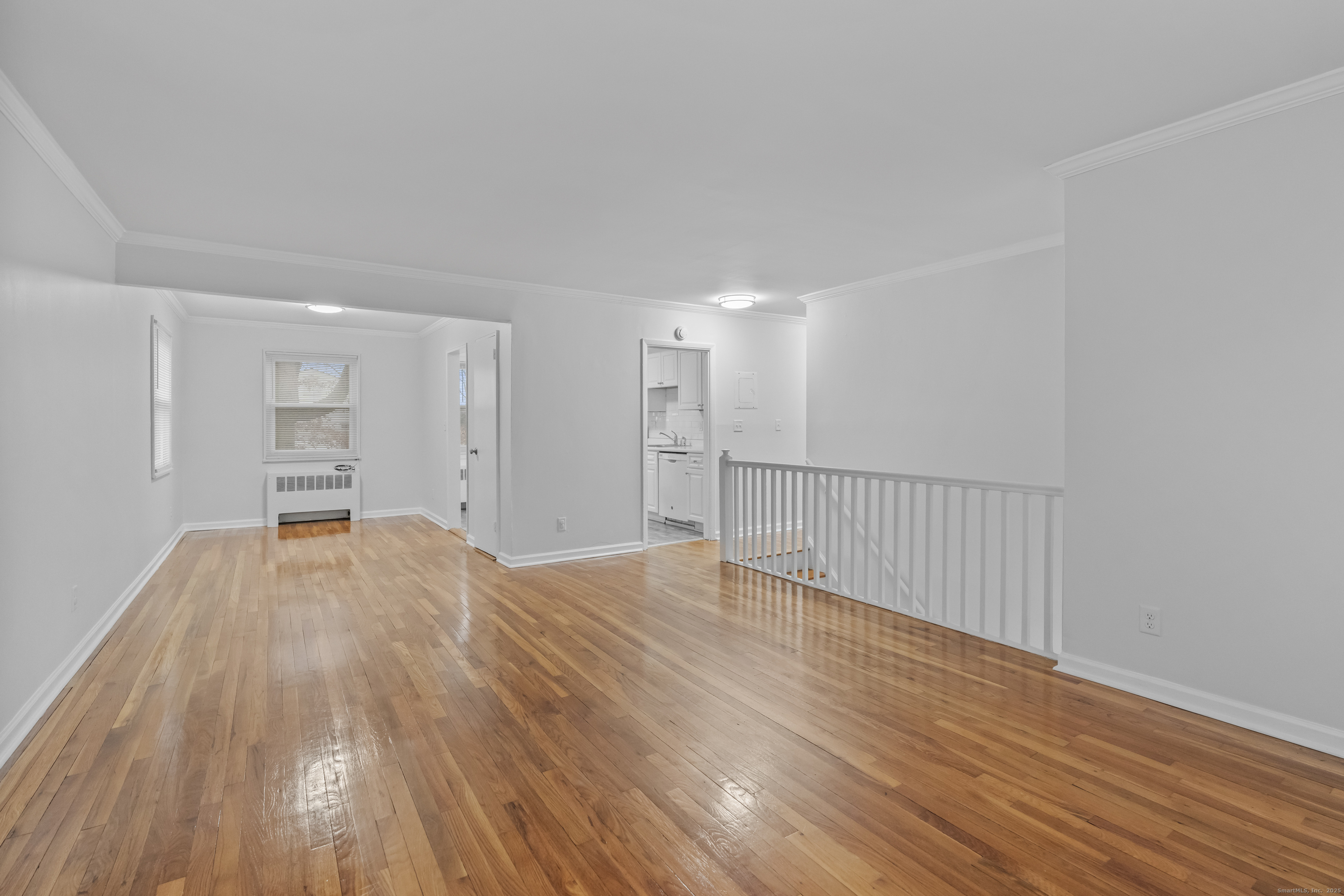 56 Blachley Road, Unit B Stamford, CT 06902 - Photo 3 of 26 a view of empty room with wooden floor