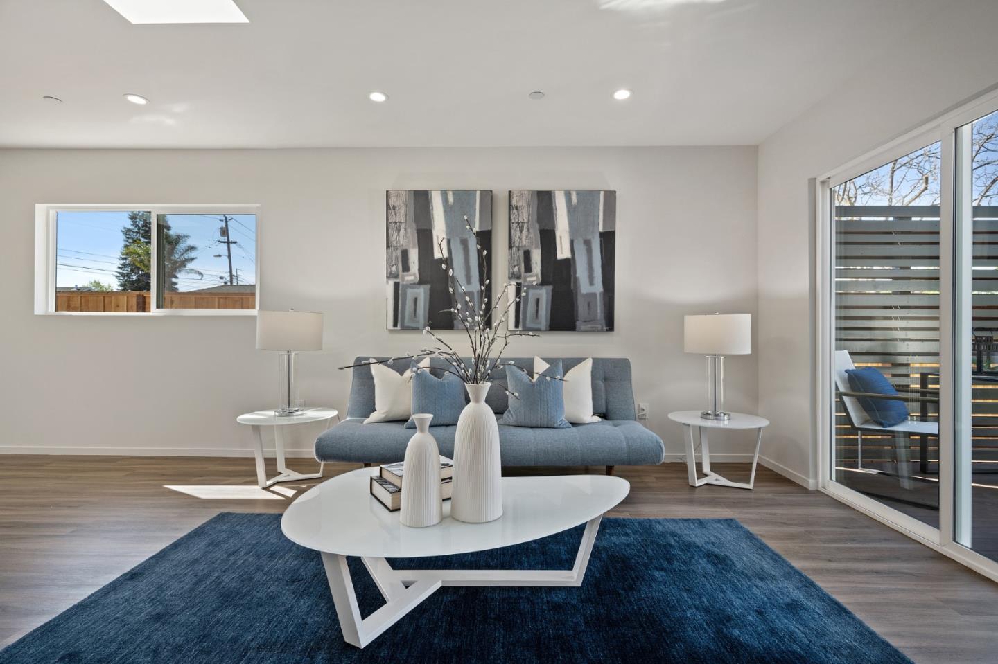 1157 Ruby Street Redwood City, CA 94061 - Photo 12 of 31 a living room with furniture a wooden floor and next to window