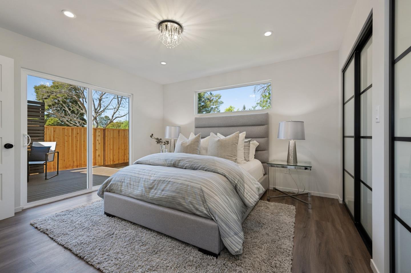 1157 Ruby Street Redwood City, CA 94061 - Photo 16 of 31 a spacious bedroom with a bed and a painting on the wall