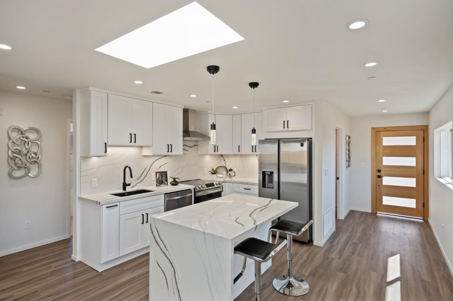 1157 Ruby Street Redwood City, CA 94061 - Photo 4 of 31 a kitchen with a sink a refrigerator and wooden floor