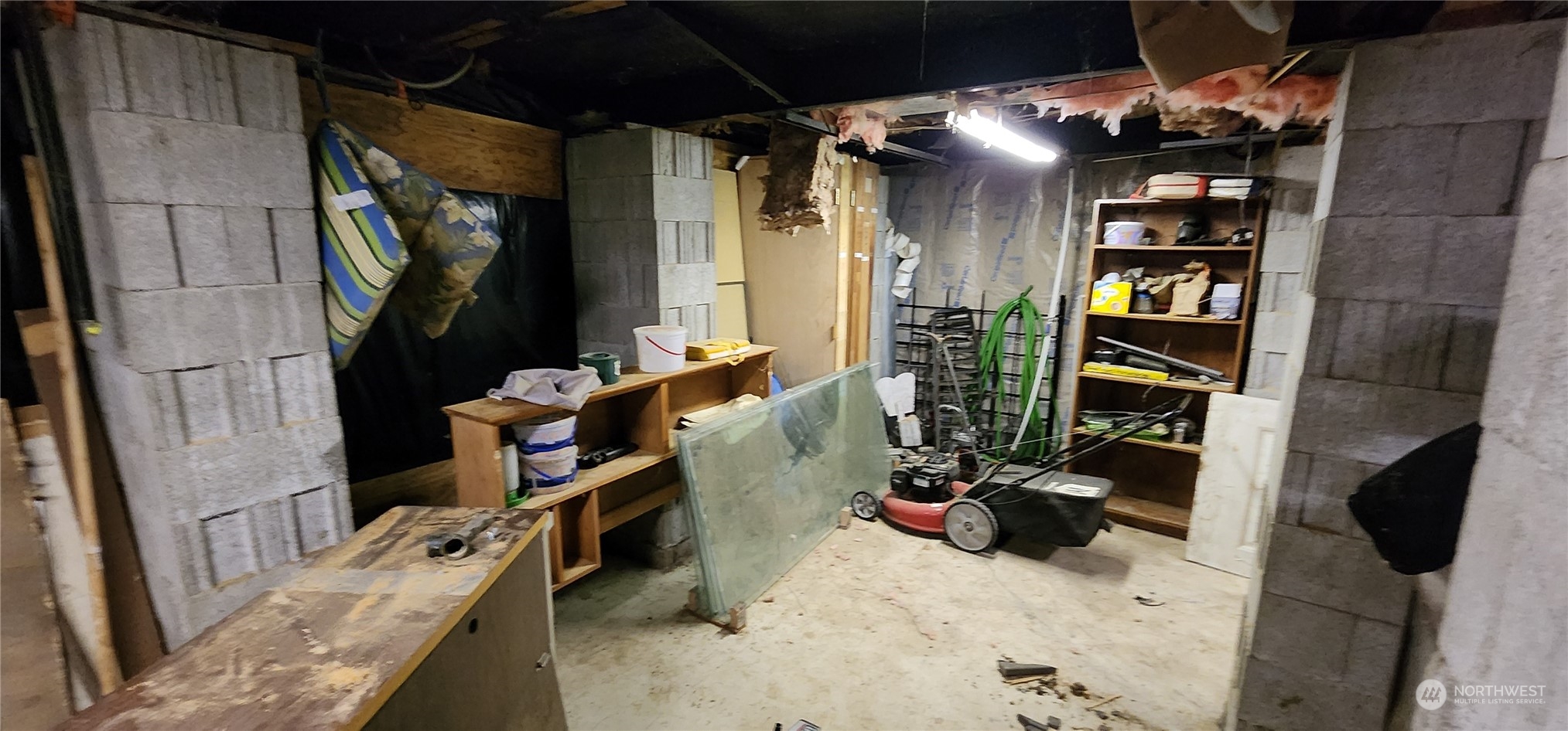 91 Maple Street Quilcene, WA 98376 - Photo 11 of 14 a view of walk in closet with clothes and shoes