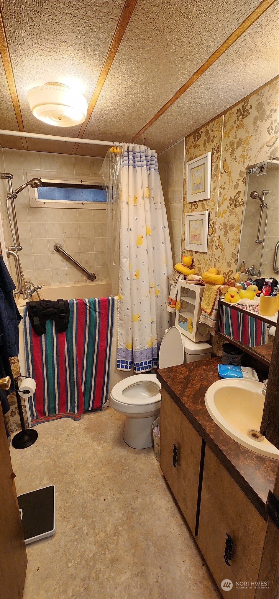 91 Maple Street Quilcene, WA 98376 - Photo 7 of 14 a bathroom with a sink a toilet and a shower