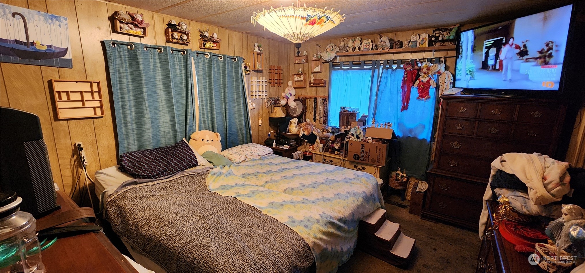 91 Maple Street Quilcene, WA 98376 - Photo 8 of 14 a bed sitting in a bedroom next to a window