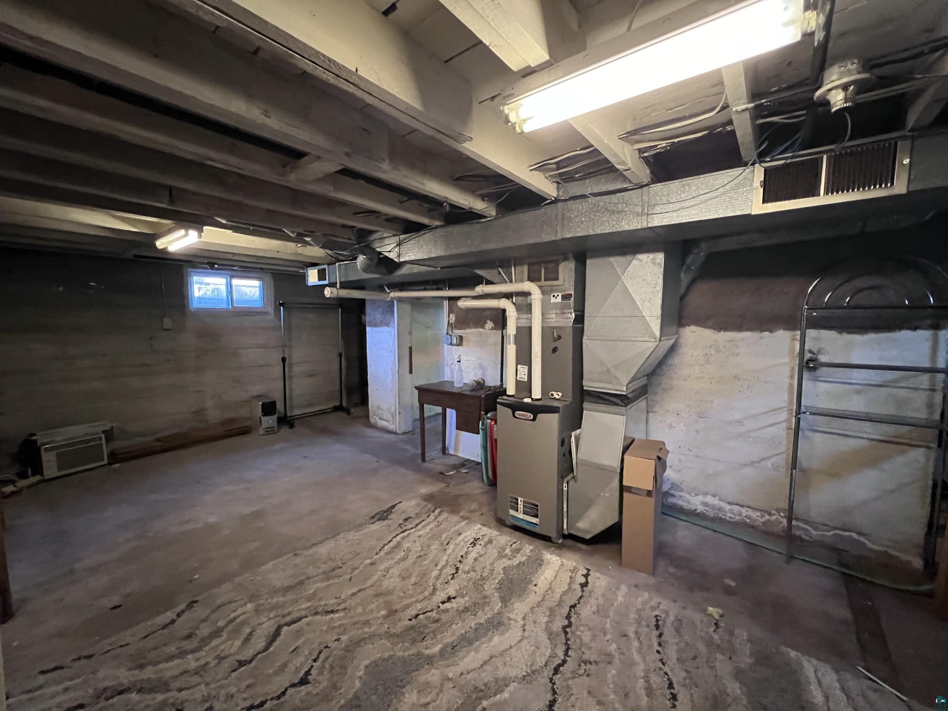 4207 East 3rd Street Superior, WI 54880 - Photo 16 of 23 Basement with heating unit
