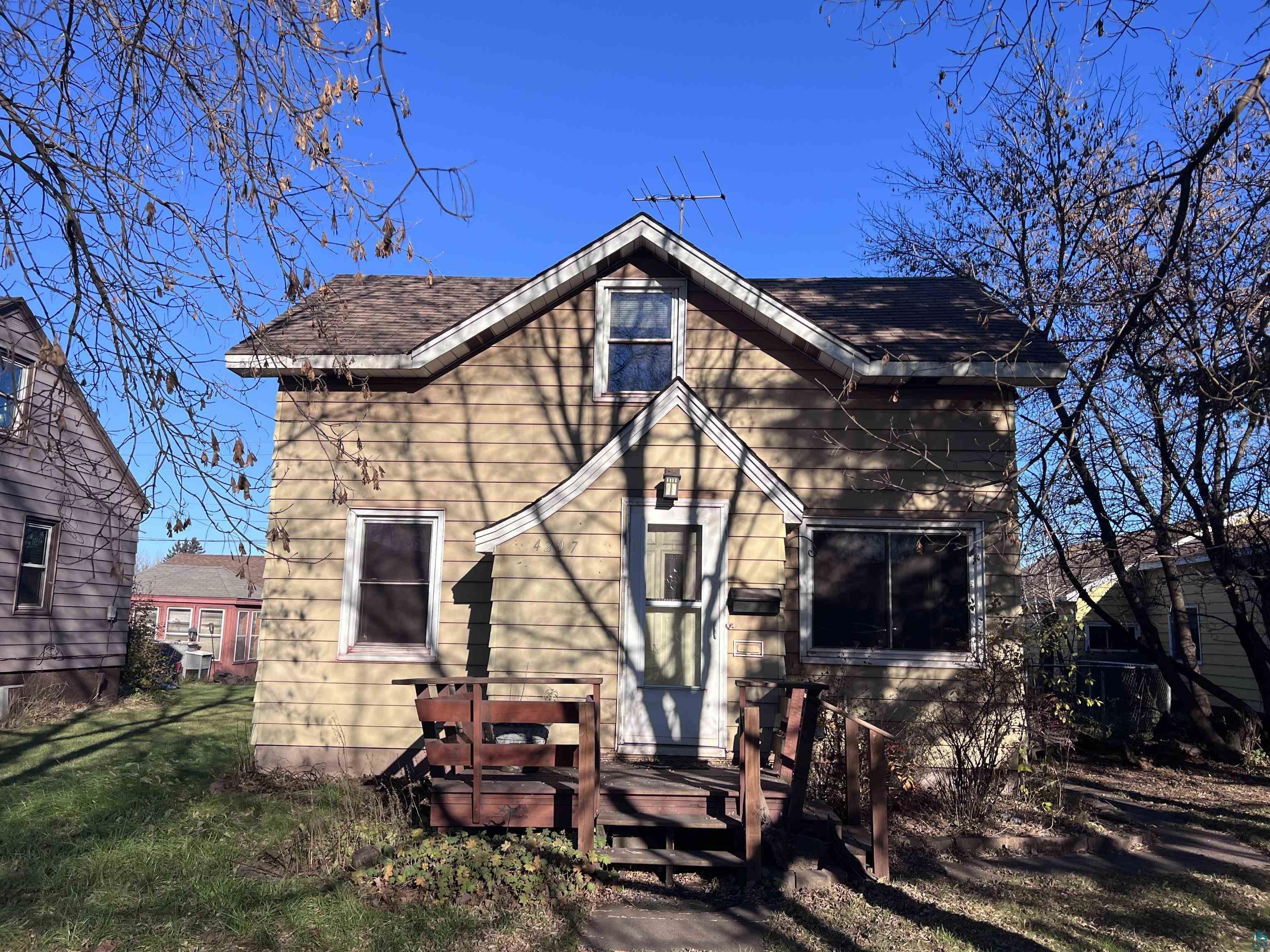 4207 East 3rd Street Superior, WI 54880 - Photo 23 of 23 Rear view of house featuring a yard