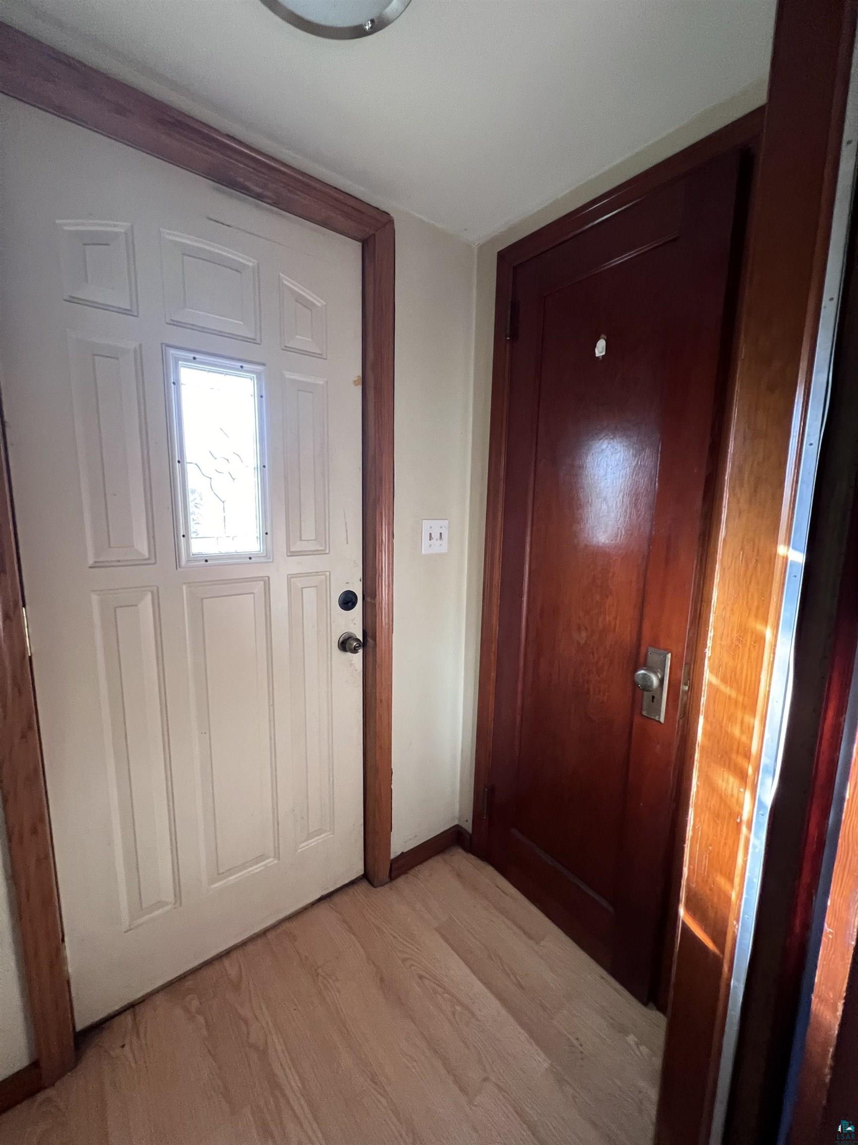 4207 East 3rd Street Superior, WI 54880 - Photo 4 of 23 Doorway to outside featuring light hardwood / wood-style floors