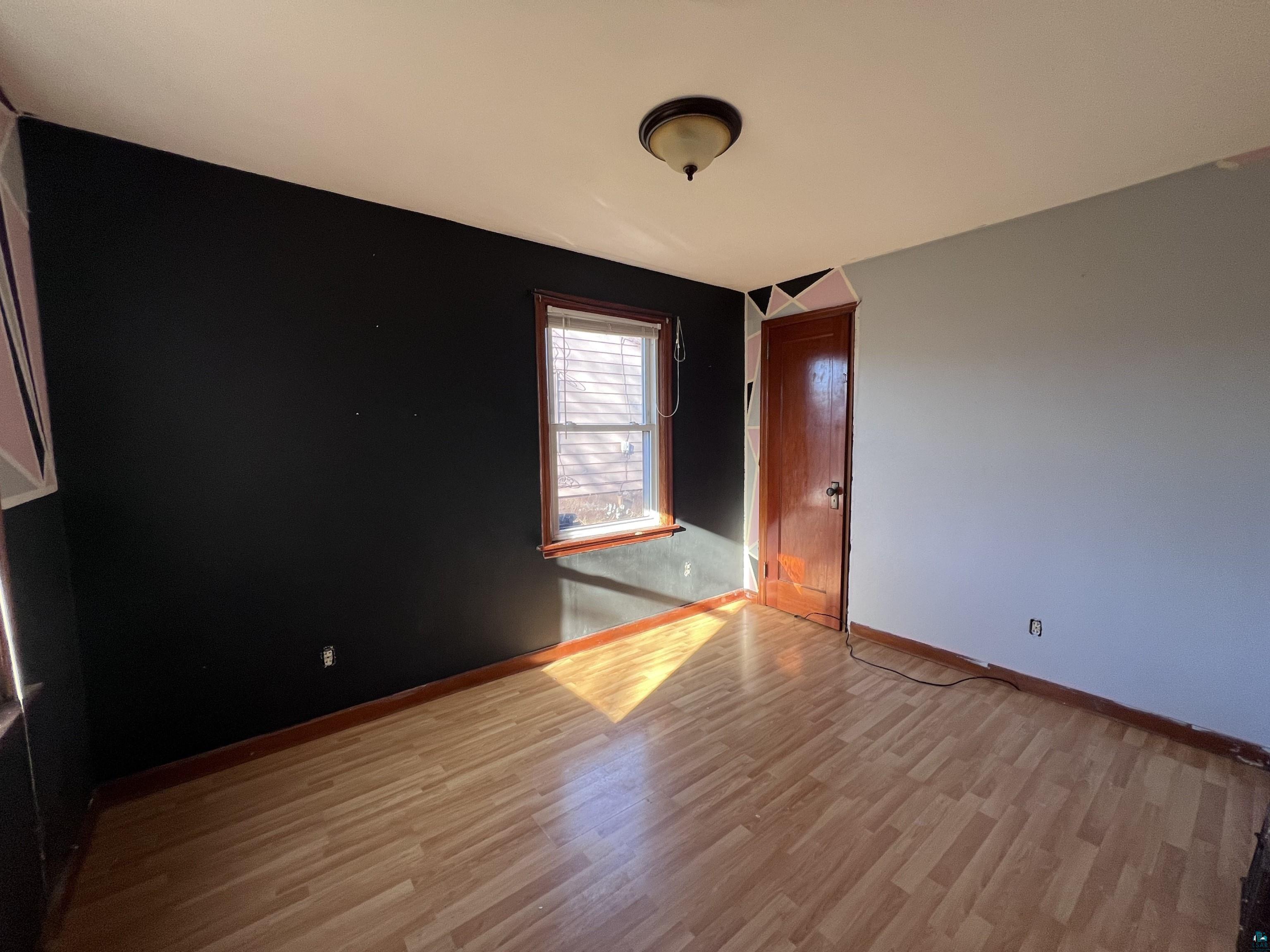 4207 East 3rd Street Superior, WI 54880 - Photo 5 of 23 Empty room featuring light hardwood / wood-style floors