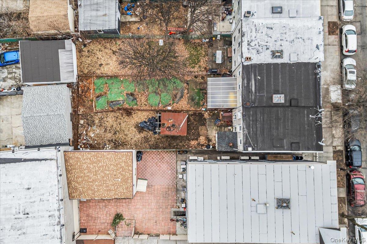 89-21 129th Street Queens, NY 11418 - Photo 2 of 19 front view of a house with a street